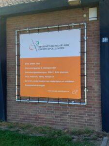 Spandoek met frame voor Regioveilig Nederland Escape opleidingen